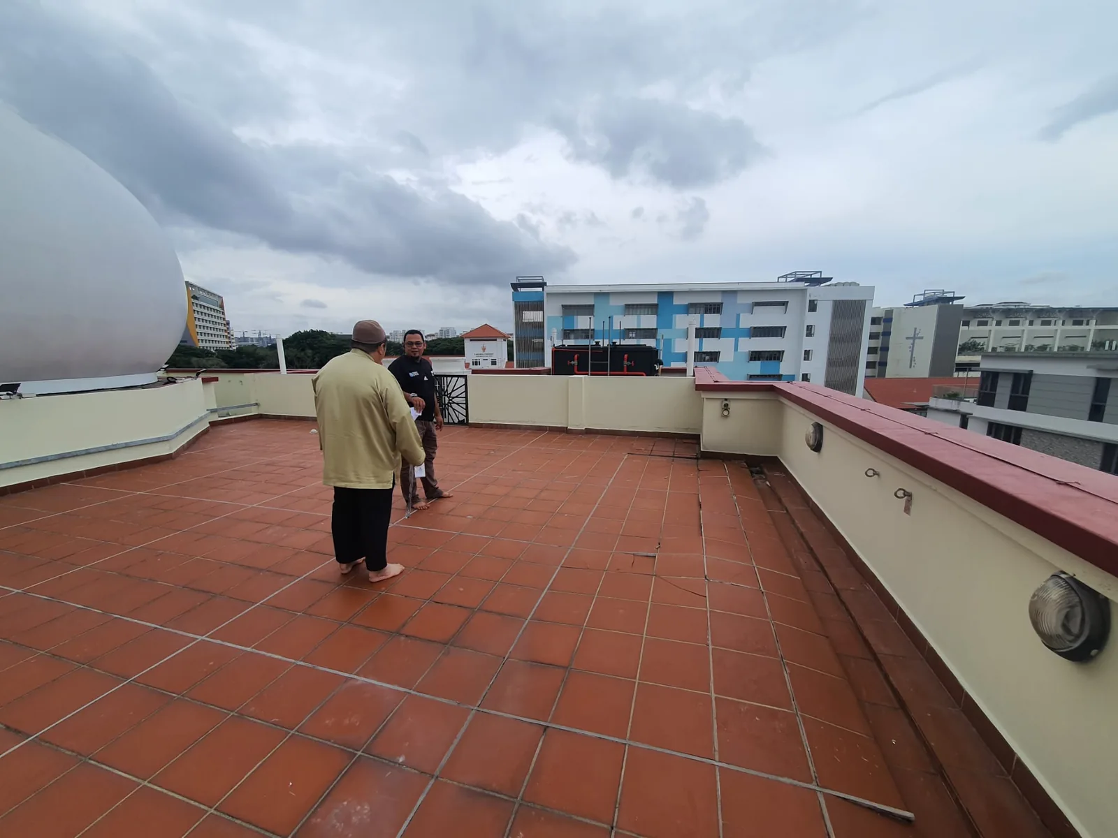Inspection of a tiled rooftop before maintenance work