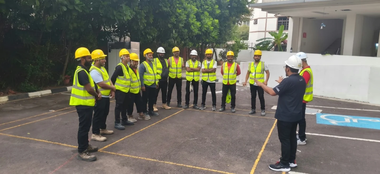 CCW team in high-visibility vests gathered for an outdoor briefing