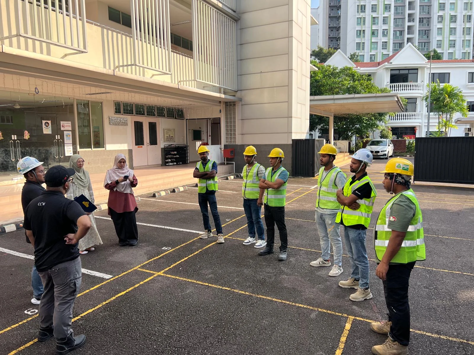 CCW team and site representatives meeting outside a building