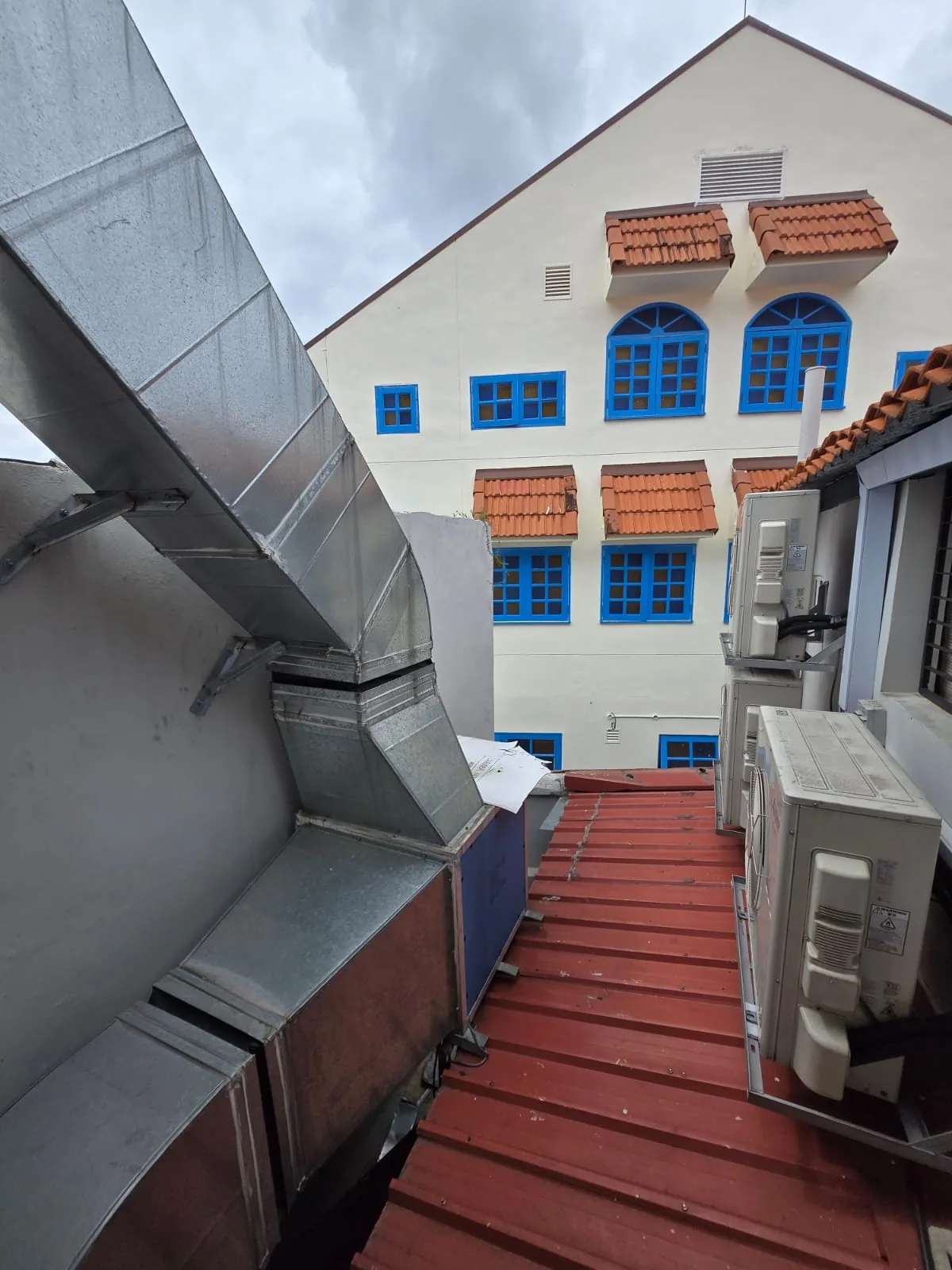 Mechanical ventilation ductwork installed beside a building